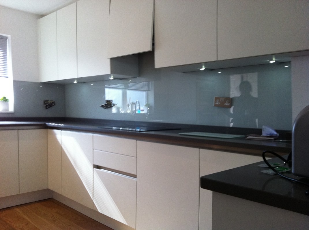 Grey glass kitchen splashback with LED lighting in Thornton Heath
