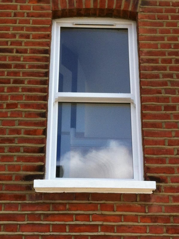 uPVC sash window on Victorian red brick house in Thornton Heath
